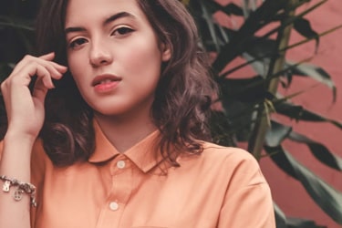 a lady wearing orange shirt